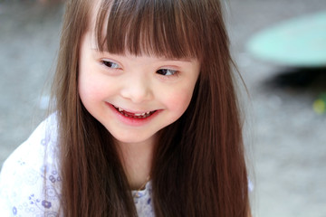 Portrait of beautiful young girl on the playground