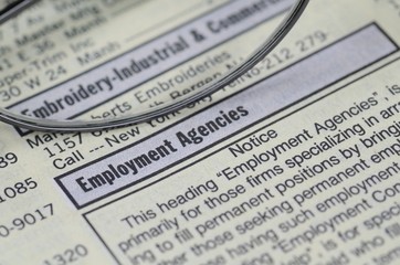 Obraz premium Searching a job from newspaper concept of employment