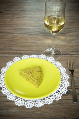 Pistachio cake on wooden background