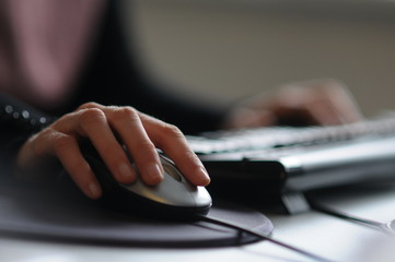 Picture of female hand on computer mouse