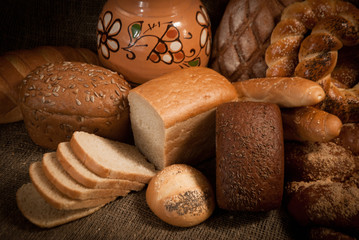 Loave of bread, cereals on sacking