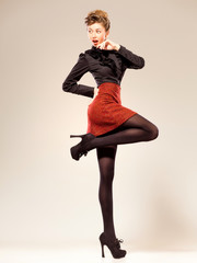 sexy woman dressed elegant doing a fashion shoot