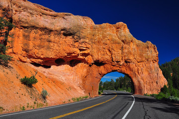 Red Arch road tunnel at bryce canyon - obrazy, fototapety, plakaty