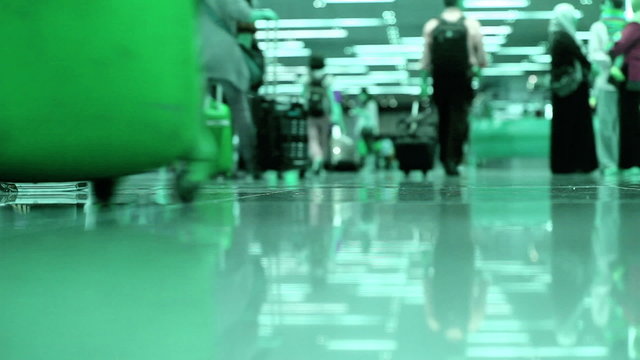 People legs walking in modern airport