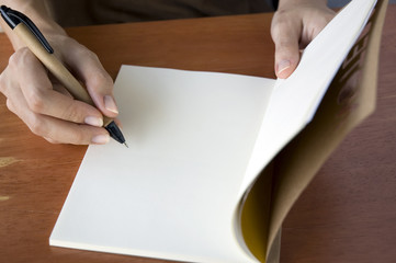 writing on notebook
