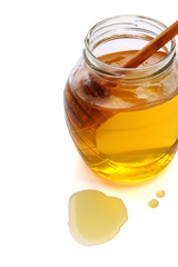 Honey with wood stick , isolated on white background