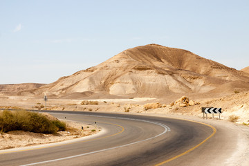 Empty road with left turn in a mountains