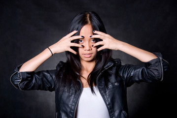 Portrait of brunette in a leather jacket.