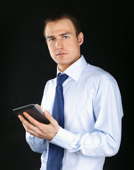 Handsome businessman using computer plane-table