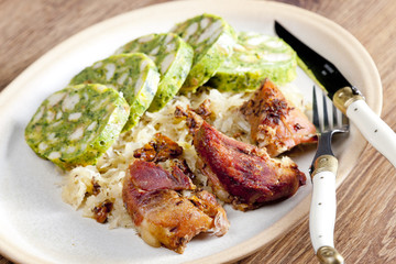 pork meat with herbal dumplings and cabbage