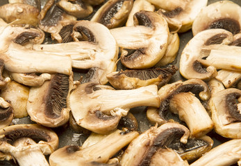 Mushrooms frying in pan