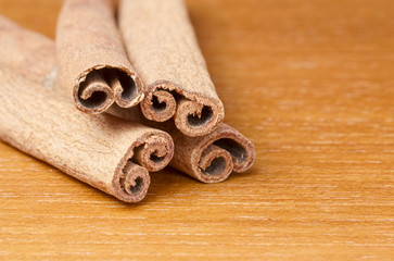 Cinnamon sticks on wooden table