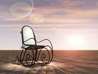 Conceptual armchair standing in dessert at sunset