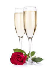 Two champagne glasses and rose