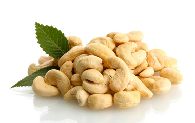 tasty cashew nuts with leaves, isolated on white