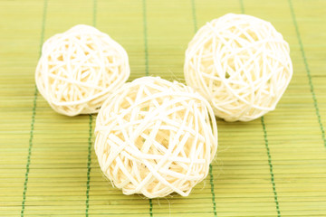 wicker bamboo balls on bamboo mat