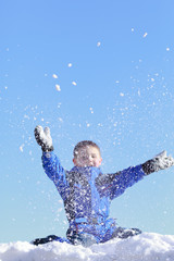 boy having fun with snow