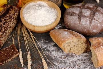 Rye bread on wooden table on wooden background close-up