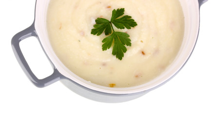 Mashed potatoes in saucepan isolated on white