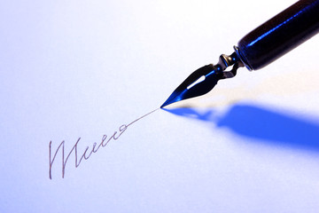 Closeup of signature (fake, not real) and ink pen, isolated
