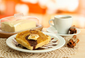 White bread toast with chocolate and cup of coffee in cafe