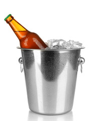 Beer bottle in ice bucket isolated on white