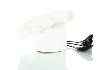 Chef's hat with spoons isolated on white