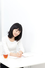 attractive asian woman studying