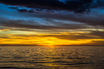 dramatic golden sunset over the ocean