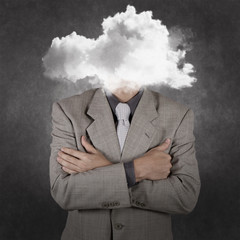 businessman with head in the clouds