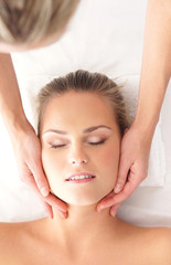Portrait of a young woman laying on a spa massage
