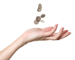 a male hand with falling coins