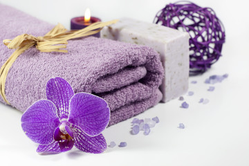 Orchid and towel spa concept with bath salt