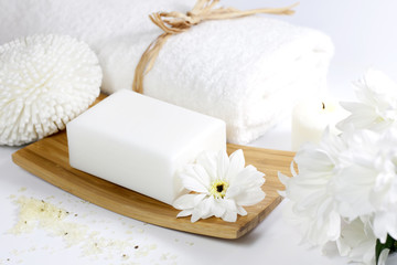 Obraz na płótnie Canvas Spa soap with towel on white background