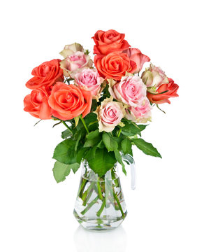 Beautiful bouquet of roses in glass vase isolated on white