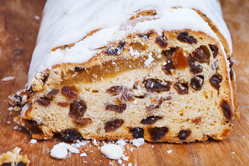 sliced Stollen cake with dried fruit and marzipan