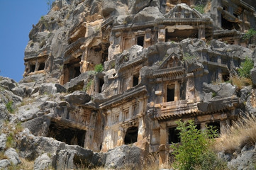 Obraz premium Historical tombs in the mountains near Myra town , Turkey . 