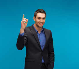 man in suit with his finger up