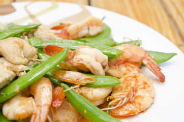 Close-up Fried shrimp, pork and sweet peas