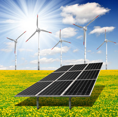 Solar energy panels with wind turbines on dandelion field