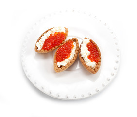 Tarts with red caviar