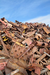 Heap of metal for recycling with blue sky