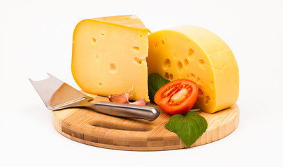 Various types of cheese and vegetables isolated on white