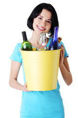 Beautiful young woman holding recycling bin