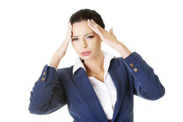 A businesswoman with a headache