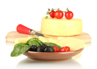 sliced mozzarella cheese with vegetables in the plate isolated