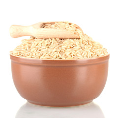 brown rice in a brown plate , isolated on white