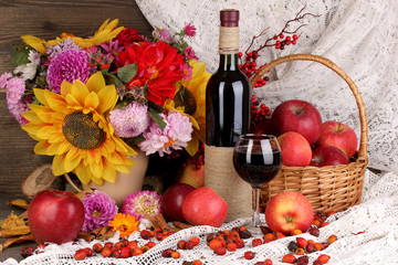Colorful autumn still life with apples and and wine close-up © Africa Studio