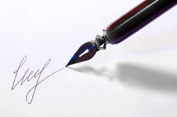 Closeup of signature (fake, not real) and ink pen, isolated