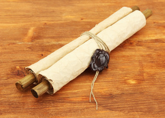 Old scroll, on wooden background